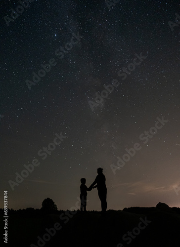 Mother and son under the stars