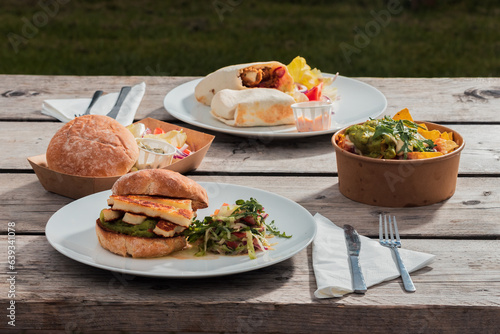 A meal set for a hearty lunch for two at an Italian café - burgers, appetizer, French fries, food photo
