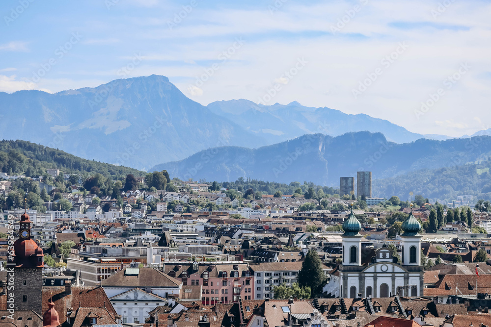 View of Lucerne rooftops, Lake Lucerne (Lake of the four forested settlements) and the Alps in the background