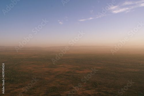 Aerial view of the Australian outback with the West MacDonnell Ranges in the morning mist, Red Centre, Northern Territory, Australia