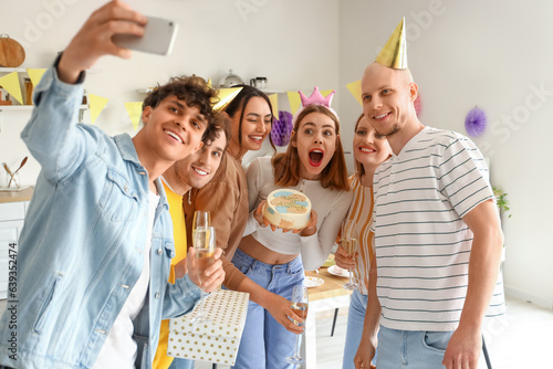 Group of young friends with...