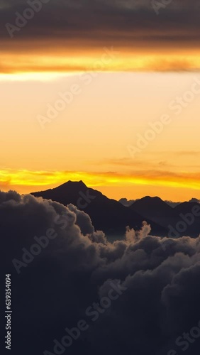 Vertical video - Timelapse of rolling clouds after sunset