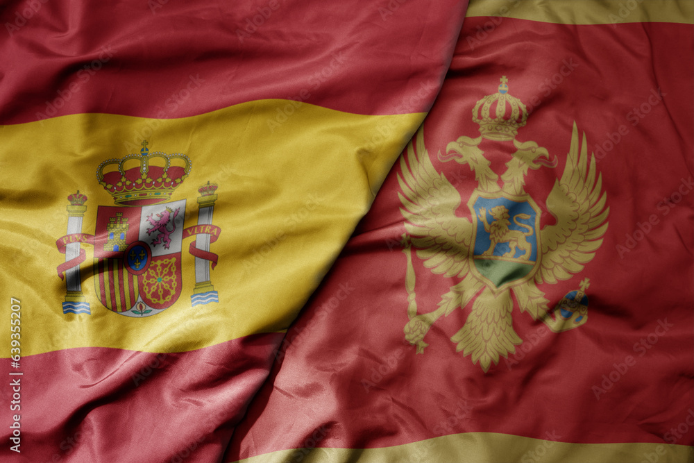 big waving national colorful flag of spain and national flag of montenegro . big waving national colorful flag of spain and national flag of montenegro .