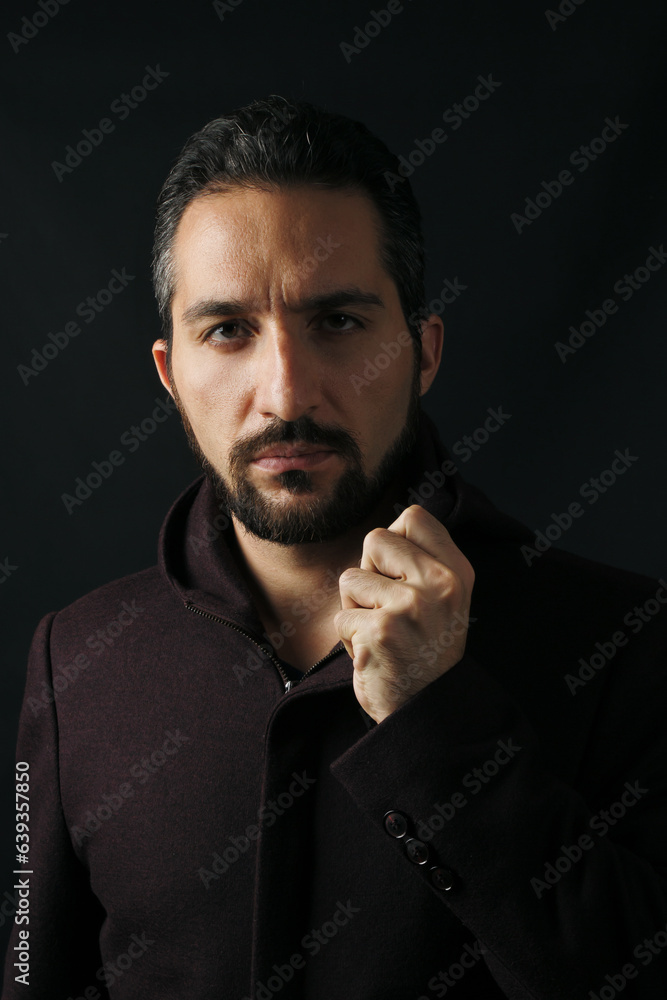 Male portrait on a dark background. Male portrait on a dark background.
