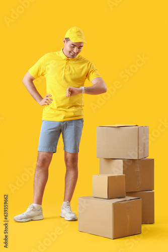 Male courier with parcels l...