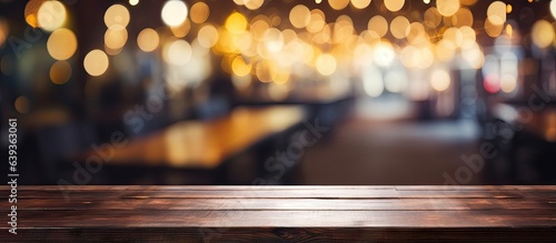 Empty wooden table in front of blurry bokeh restaurant backdrop Suitable for product display or montage Used for mock ups