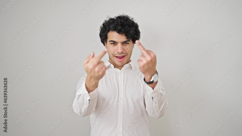 Young latin man business worker smiling confident doing middle finger gesture over isolated white background Young latin man business worker smiling confident doing middle finger gesture over isolated white background
