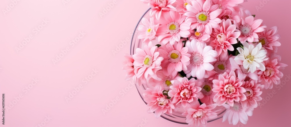Pink flowers in a vase seen from above