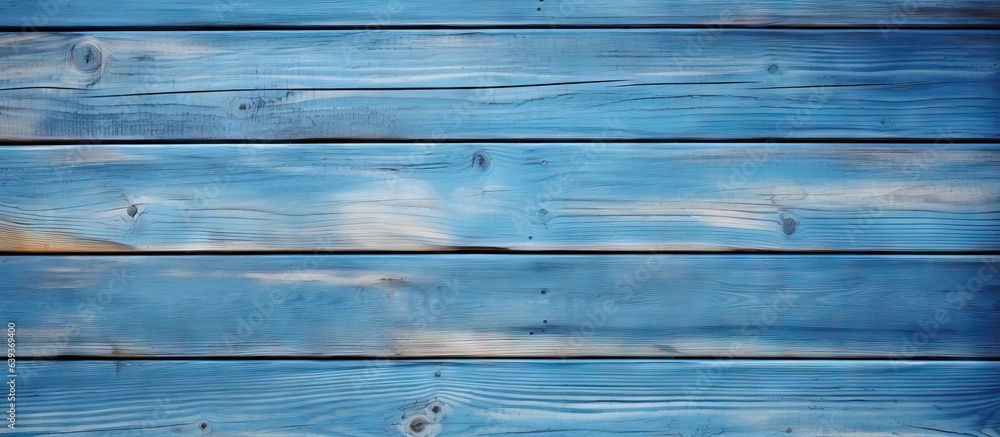 Fototapeta premium Room with a light colored wooden wall and a blue background