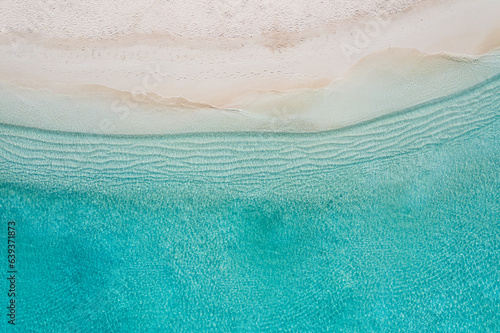 Relaxing aerial beach scene, summer vacation holiday template banner. Waves surf with amazing blue ocean lagoon, sea shore, coastline. Relaxing aerial drone top view. Peaceful bright beach, seaside