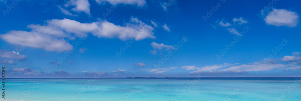 Tropical Mediterranean sea sky clouds horizon over water. Horizontal panoramic seascape skyscape banner wallpaper. Blue azure turquoise ocean bay. Tranquil serene nature. Calm peaceful island beach