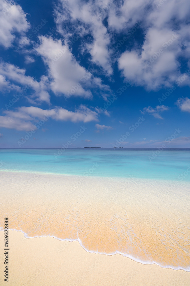 Fototapeta premium Tropical beach view. Calm and relaxing empty beach scene, blue sky. Tranquil nature. Summer seascape skyscape beautiful waves splashing on beach sand, blue sea water in sunny day. Meditation ocean