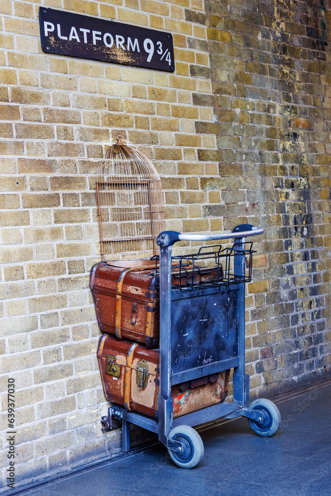 Fototapeta premium London, UK - May 20, 2023: Platform 9 3/4 at king's cross station. This is the British Rail homage to Harry Potter at Kings Cross station in London England