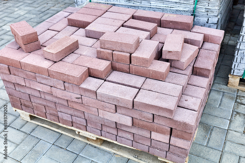 Fototapeta premium concrete paving slabs stacked on pallets outdoor of workshop