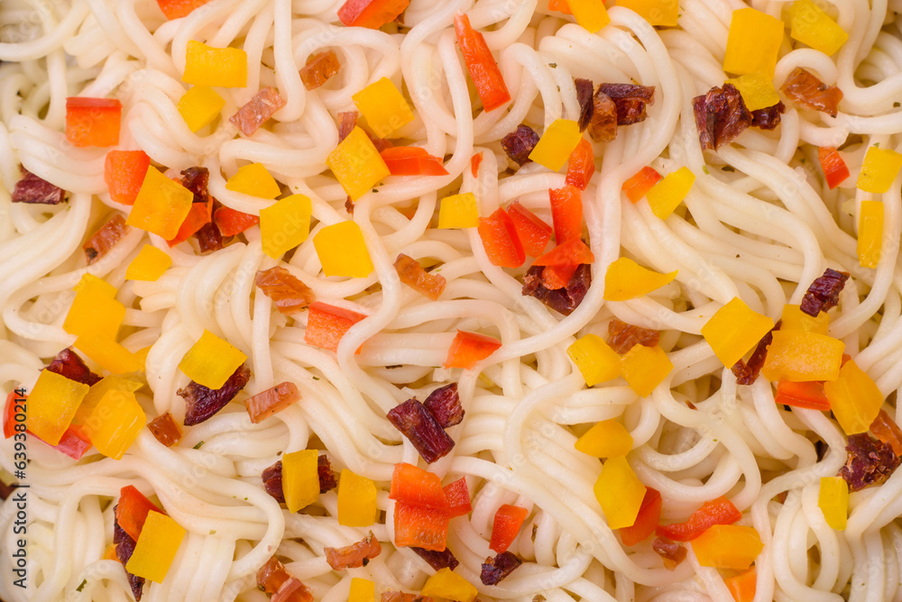 Delicious fresh Asian noodles with pieces of vegetables, meat, with salt, spices and herbs Delicious fresh Asian noodles with pieces of vegetables, meat, with salt, spices and herbs