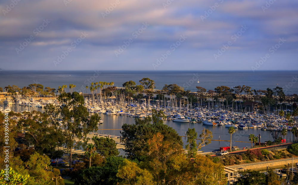 Sunset over luxury yachts and boats in Dana Point harbor, Orange county in Southern California