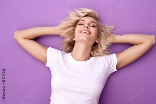 female on back laying down waering white tshirt for mock up on purple background