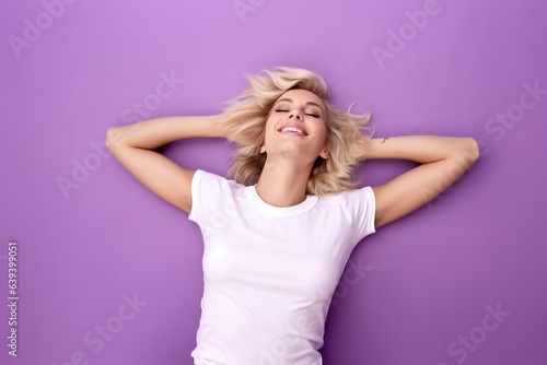 female on back laying down waering white tshirt for mock up on purple background