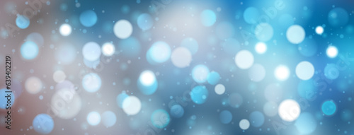 Abstract background with bokeh effect in light blue colors