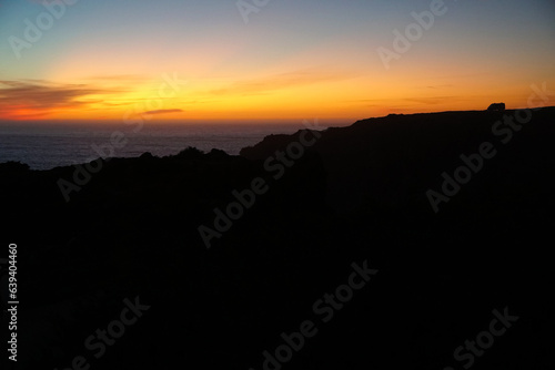 Wallpaper Mural silhouette of camper vans parking on cliff during sunset   Torontodigital.ca