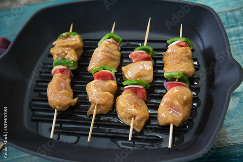 Shish Tawook or Grilled chicken with tomato pieces, green pepper and onion pieces, ready for grilling
