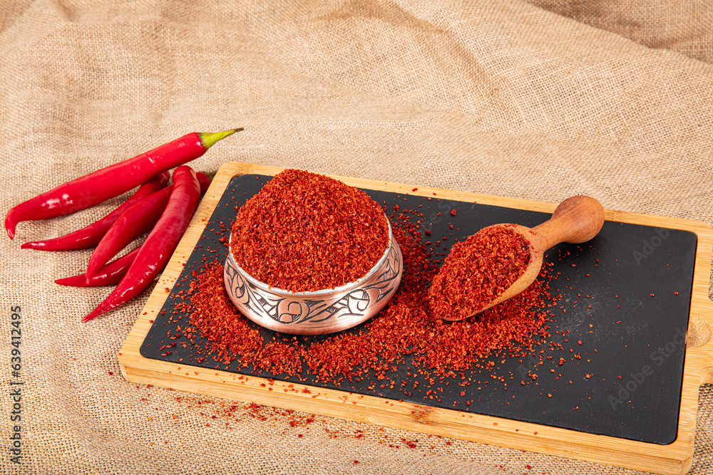 Dried red pepper flakes, chili pepper spice. Red pepper flakes. Heap of