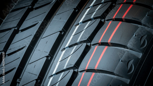 Close-up of grooves tire tread for safety and car grip. Workshops advertisement brochure.