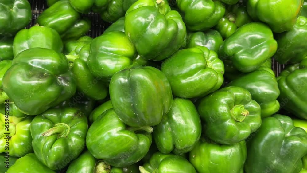 Fresh Green pepper background. Layout with Green pepper. Capsicum, Pepper in the supermarket. Fresh Green pepper background. Layout with Green pepper. Capsicum, Pepper in the supermarket.