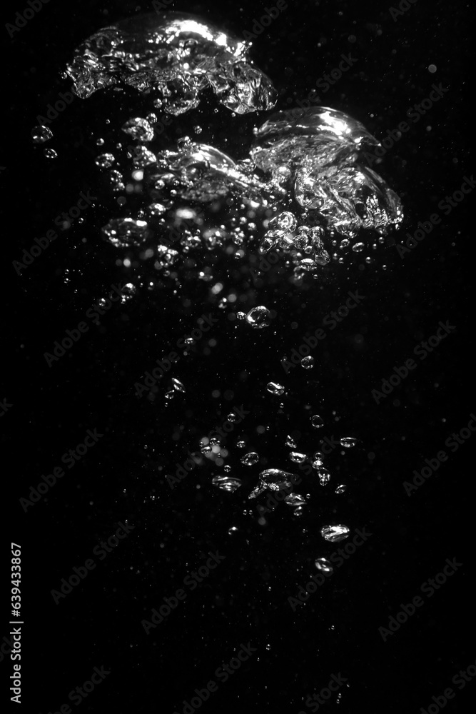 Air bubbles in water on black background Air bubbles in water on black background