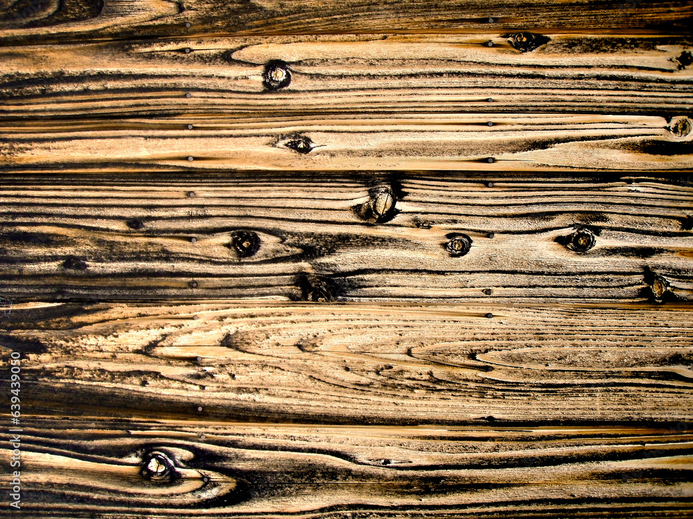 Traditional Japanese method of wood preservation. Charred cedar board fence Traditional Japanese method of wood preservation. Charred cedar board fence