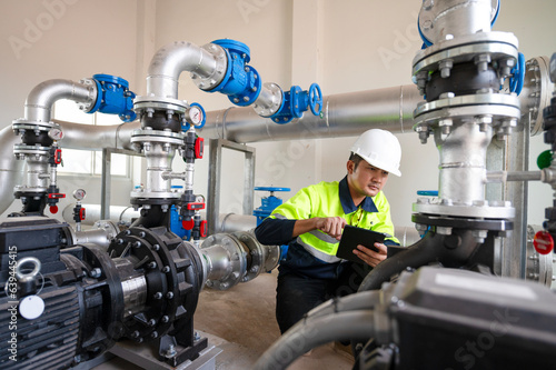 Maintenance engineers inspect the system of pumping stations and pipes delivering clean water and water storage tanks for the community. photo