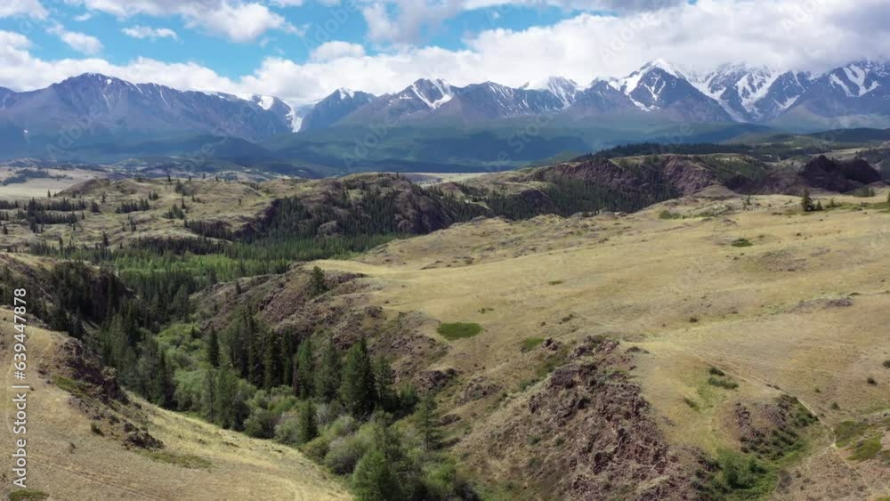 Aerial video of hills and Altai mountains in Kurai area with North Chuisky Ridge on background. Aerial video of hills and Altai mountains in Kurai area with North Chuisky Ridge on background.
