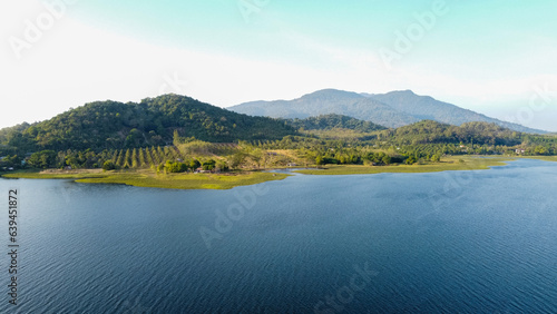 Aerial view of Lake and Beautiful mountains on blue sky background.