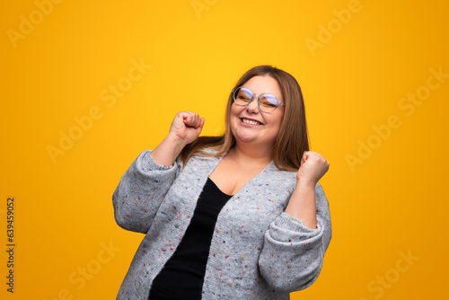 Fotografi Excited plus size woman rejoicing over success