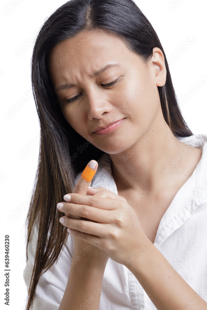 Young Asian American woman with injjured finger on white background Young Asian American woman with injjured finger on white background