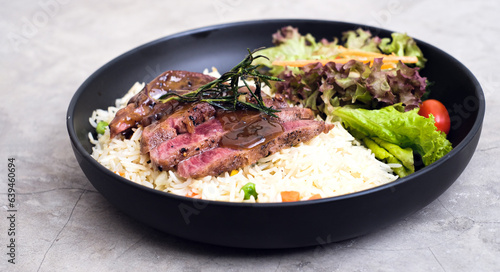 New York-Style Sliced Beef with Butter Rice and Vibrant Vegetables