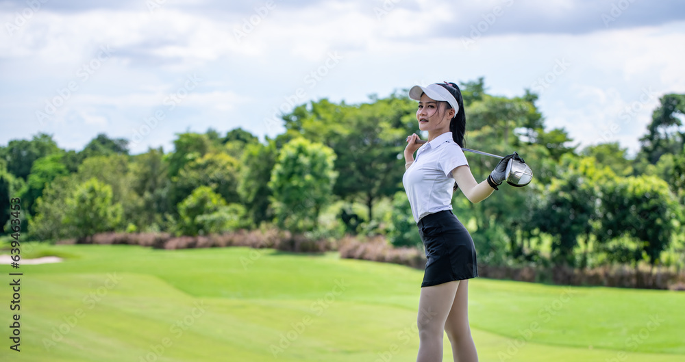 Portrait woman professional golfer under warm-up exercise stretching muscles with golf club before starting the game at the green golf course