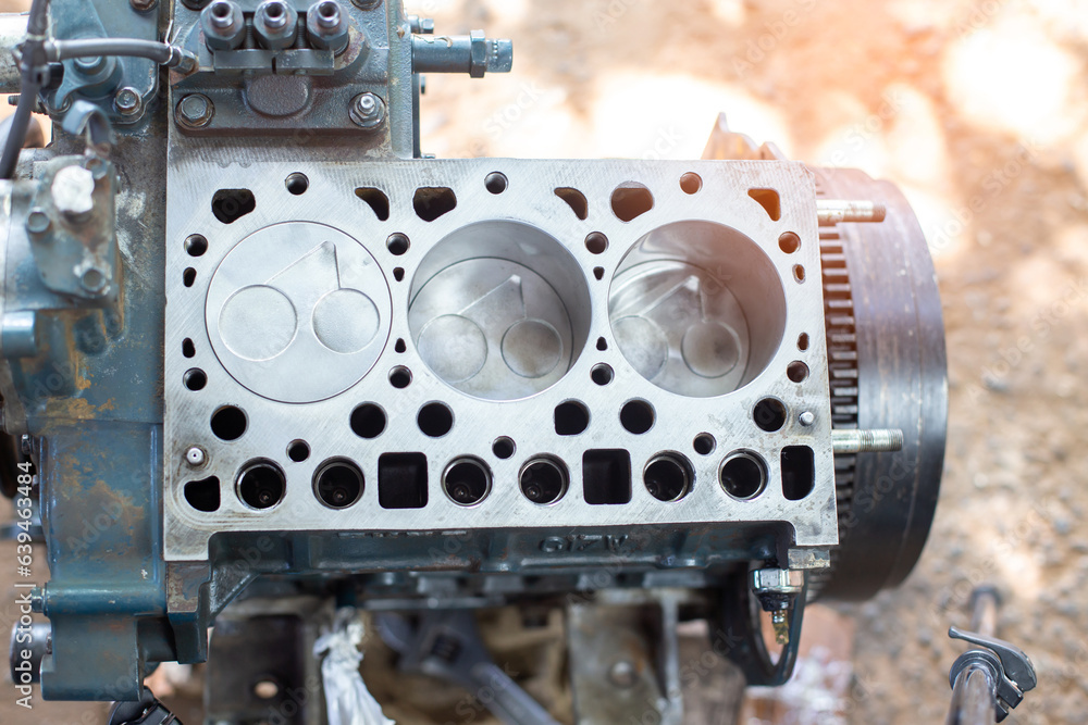 Engine cylinder head lying on a table in a car service. Maintenance the