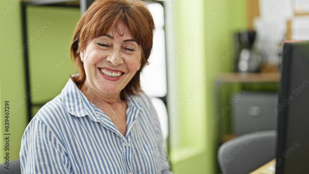 Middle age woman business worker using computer working at office Middle age woman business worker using computer working at office