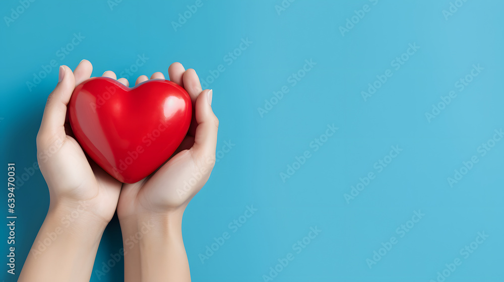 Obraz premium World Heart Day Concept with Hands Holding Red Heart