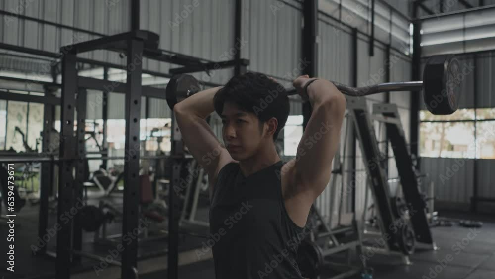 Man exercising in the gym, Weight lifting, Fitness Enthusiast Working Out, Powerful Arm Muscle Strengthening in Gym Workout Session, Fitness and Health Routine, Weight lifting. Man exercising in the gym, Weight lifting, Fitness Enthusiast Working Out, Powerful Arm Muscle Strengthening in Gym Workout Session, Fitness and Health Routine, Weight lifting.