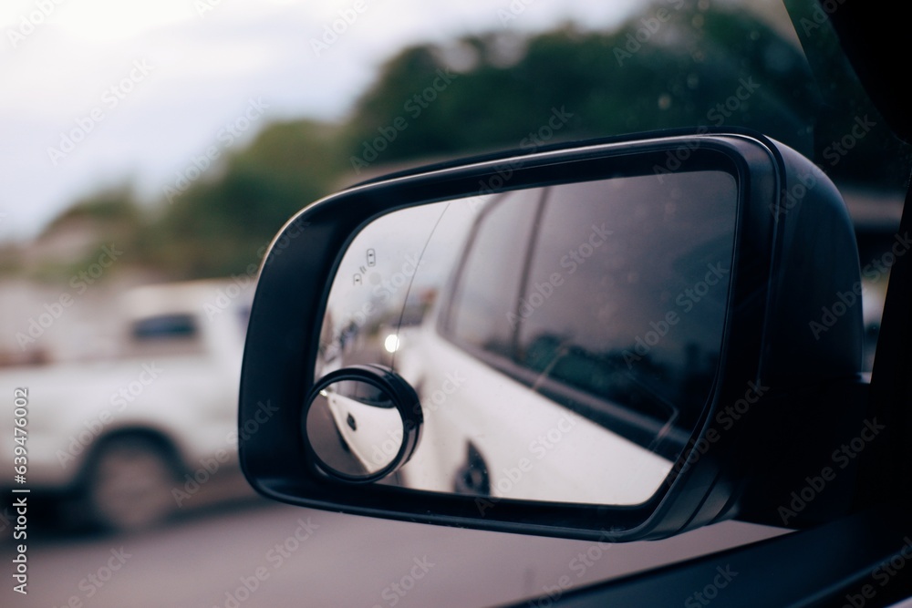 Traveling on a rainy day. Highway reflection in a car mirror Traveling on a rainy day. Highway reflection in a car mirror