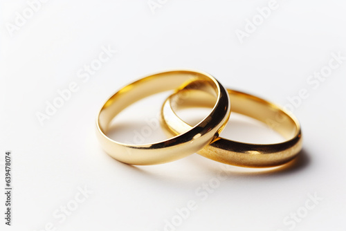 Eternal Union: Two Golden Wedding Rings Isolated on White - Symbol of Enduring Love - Created with Generative AI Tools