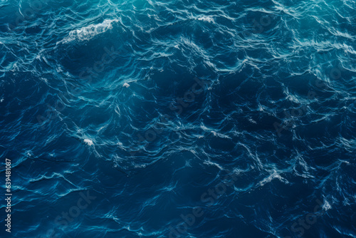 High angle shot of the Deep blue ocean with waves and ripples