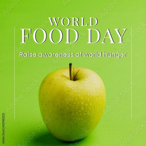 Composite of world food day and raise awareness of world hunger text and granny smith apple