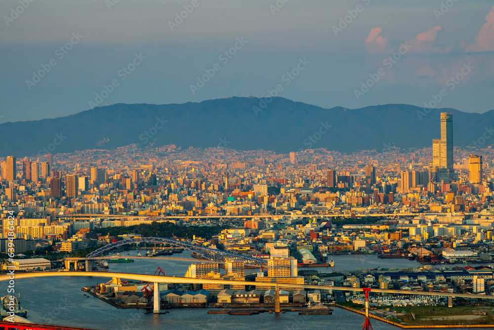 sunset or sun rise of  Osaka cityscape with Skyline and office building and downtown of Osaka with twilight sky in summer season, Osaka city, Japan