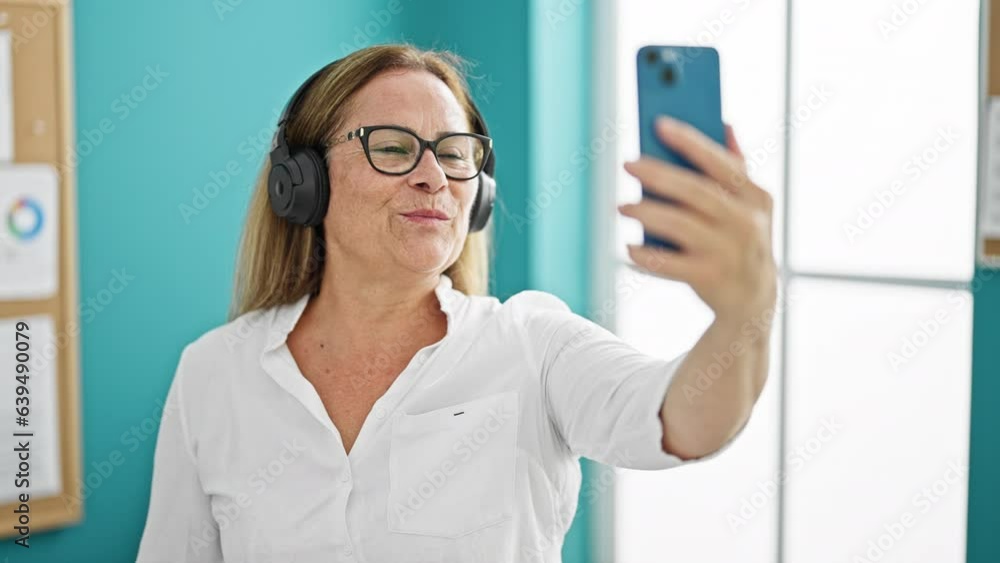 Middle age hispanic woman business worker having video call at the office