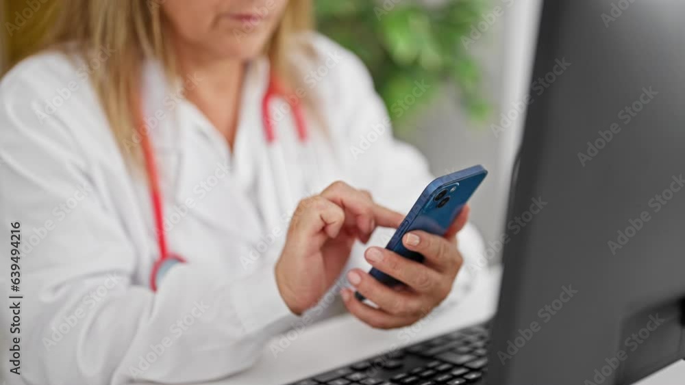 Middle age hispanic woman doctor using computer and smartphone at the clinic