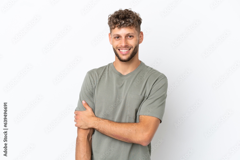 Obraz premium Young caucasian handsome man isolated on white background laughing