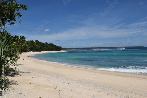 View of a wide beach in Indonesia with a clear blue sky and no people on it.  © masb2t